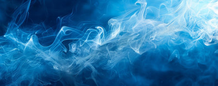 Smoke background with ghostly white smoke flowing against a deep blue night sky.の素材