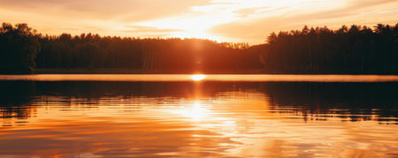 A serene lake sunset background with warm orange hues, calm water, and textured reflections. The peaceful, picturesque view creates a relaxing, tranquil scene.の素材