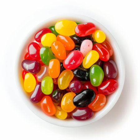 A bowl of assorted jelly beans in bright colors, isolated on white backgroundの素材