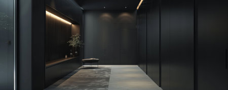 A minimalist hallway with built-in storage and a dark wall. The dark background creates a clean and sophisticated look.の素材