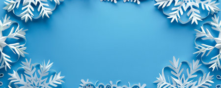 A cut-out paper banner in the shape of a snowflake, with detailed cutouts, layered over a cool blue background, creating a wintery feel.の素材