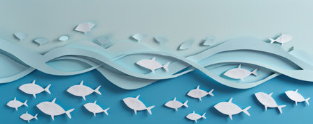 A cut-out paper banner with fish patterns, layered on an ocean blue background, creating an aquatic and serene visual.の素材