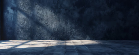 A dramatic scene featuring an empty wall in deep sapphire blue, with a matte finish and soft shadows, creating a rich and sophisticated backdrop.の素材