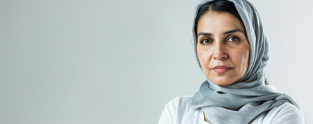 Unhappy middle-aged Arabian woman against a white background banner with copy space.ai generatedの素材