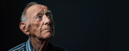 Unhappy senior Caucasian man against a black background banner with copy space.ai generatedの素材