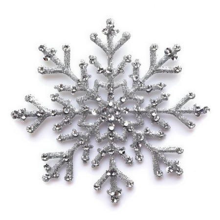 A glittering silver snowflake ornament with a delicate design, isolated on white background.の素材