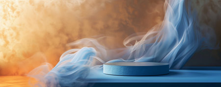 A sleek blue podium with an empty pedestal on a rich metallic gold background, with delicate white smoke curling around. The cool, sophisticated colors and the smoky atmosphere create a modern and elegant visual.の素材