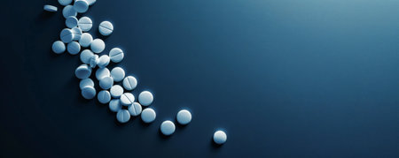 A simple and elegant display of white pills on a dark blue background, with a generous area on the right side left blank for text. The contrast between the white pills and the dark background creates a striking effect.の素材