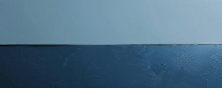 A serene dual-color background with a smooth blend of soft blue and deep navy, evoking a sense of calm and tranquility.の素材