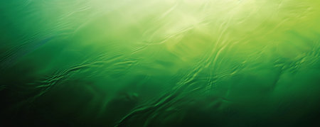A striking green background with a gradient that transitions from dark green at the top to a lighter green at the bottom, adding a sense of movement and dynamism.の素材