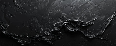 A soft black background with a faint grainy texture, giving it a slightly organic and natural feel.の素材