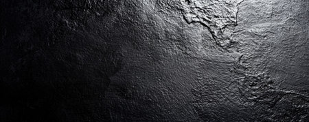 A bright black background with a subtle grainy texture, creating a modern and sophisticated look.の素材