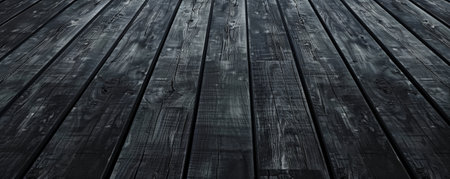Dark charcoal wooden floors set horizontally, providing a dramatic backdrop for enhancing website or wallpaper designs with plenty of room for text or graphics.の素材