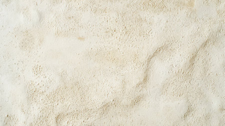 A cream textured background with a fine sandpaper texture. The subtle roughness adds a unique tactile quality.の素材