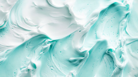 A mint abstract background showing a light, frothy texture, reminiscent of whipped cream. The airy design adds a playful and whimsical touch.の素材
