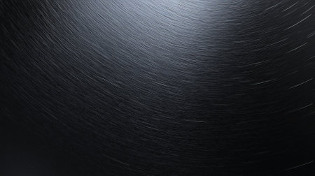 A matte black background with a subtle texture resembling brushed metal. The central area is smooth and unadorned, providing space for design.の素材