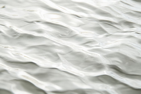 A light white textured surface with a subtle, rippled effect, mimicking the gentle undulations of a serene water surface.の素材