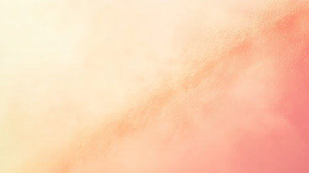 A soft pastel gradient fading from pale coral to soft beige, with smooth, delicate blending creating a warm, serene background.の素材