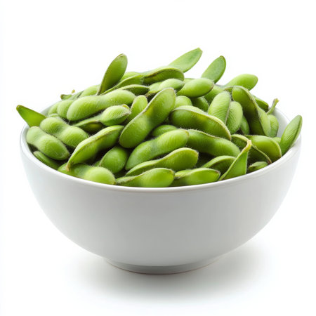 A bowl of freshly steamed edamame, isolated on a white background, emphasizing their bright green color and nutritious appealの素材