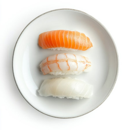 A plate of sushi nigiri with fresh fish and rice, isolated on a white background, showcasing detail and freshnessの素材