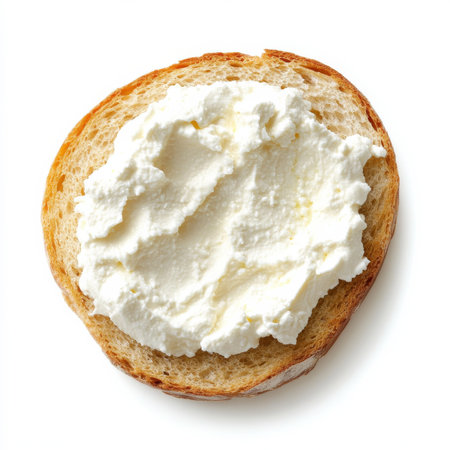 A soft ricotta cheese spread evenly on bread, isolated on a white background, showing a rich, creamy consistencyの素材