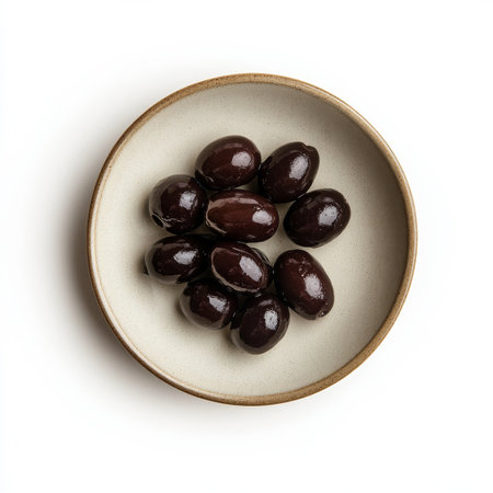 A small plate of cured olives, isolated on a white background, emphasizing a savory snack optionの素材