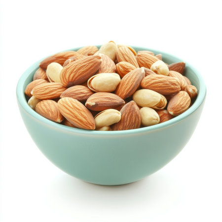A bowl of mixed nuts, isolated on a white background, highlighting a healthy snack choiceの素材