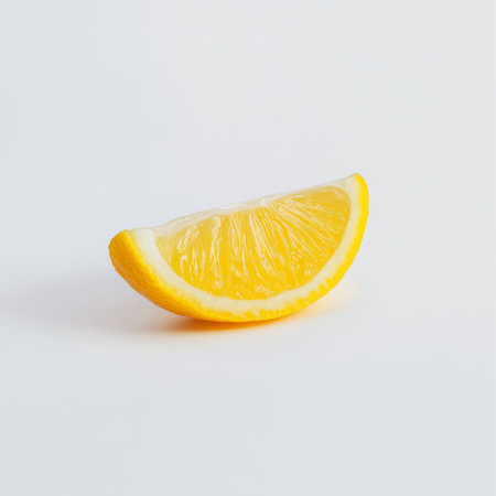 A single slice of lemon, isolated on a white background, showing a versatile citrus fruitの素材