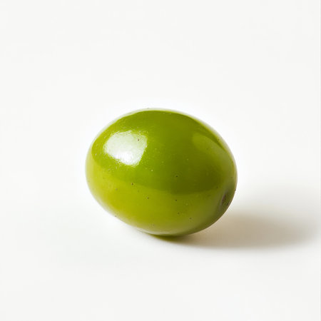 A single green grape, isolated on a white background, emphasizing a small, juicy fruitの素材