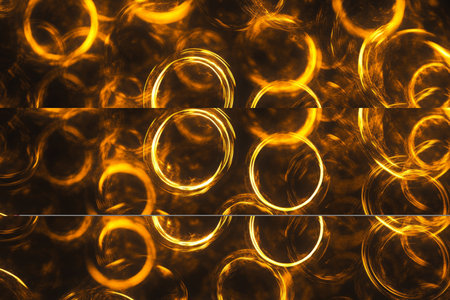 Abstract glowing ringlets texture, bright yellow and orange spirals on a dark backdrop, futuristic and energeticの素材
