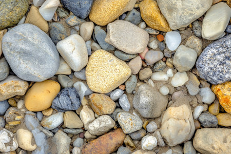 Coarse gravel texture, rough mix of small stones in varying shades of gray, natural and ruggedの素材