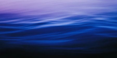 A minimalist gradient background with soft transitions between shades of deep blue and purple. The smooth and calming design is versatile for creative projects.の素材