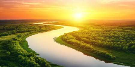A serene river delta with winding waterways cutting through lush green wetlands. The setting sun paints the sky in shades of orange and pink, reflecting off the calm water.の素材