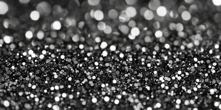 A glaming charcoal gray glitter background with glistening silver sparkles scattered throughout. The mix of dark tones and bright reflections creates a chic, sophisticated look, ideal for corporate branding, digital art, or event decor.の素材