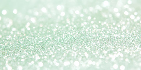 A sparkling mint green glitter texture, with soft, pastel hues. The light and refreshing feel is ideal for eco-friendly product packaging, nature-themed branding, or spring event promotions.の素材