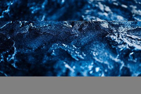 Macro shot of crushed velvet texture, luxurious soft fabric with shifting light reflections in royal blue.の素材