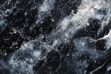 Close-up of smooth granite texture, speckled gray and black with a polished, glossy finish.の素材