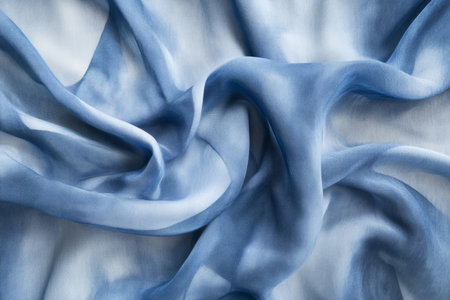 Seamless chambray blue watercolor wash, fluid organic shapes blending effortlessly.の素材
