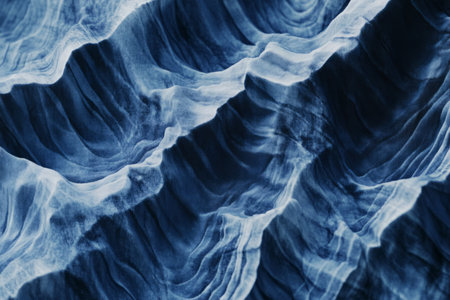 Soft, crinkled Japanese shibori-dyed textile, deep indigo with organic, tie-dye wave patterns.の素材