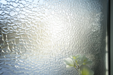 Textured frosted glass surface, smooth with light diffusion, showing delicate textures that evoke a sense of serenity.の素材