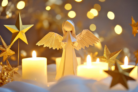 A delicate paper angel figurine, standing among softly glowing candles and surrounded by golden paper stars.の素材