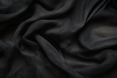 A high-detail mesh fabric texture background in black, featuring an intricate open-weave pattern. The fine, geometric grid creates a sense of transparency and structure, ideal for modern, breathable, and sporty textile applications.の素材