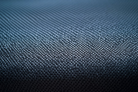 A modern neoprene fabric texture background in sleek charcoal gray. The thick, smooth material with slight elasticity provides a futuristic, technical feel, perfect for wetsuits, avant-garde fashion, and industrial design.の素材