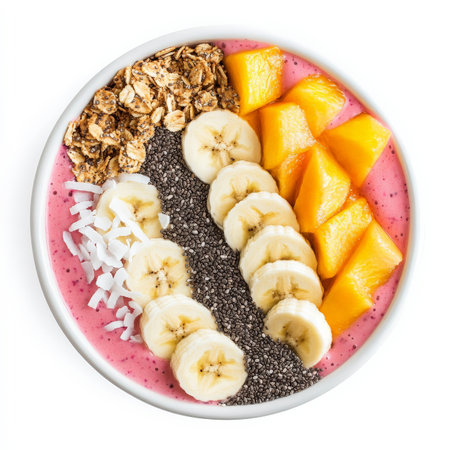 A colorful smoothie bowl made with blended tropical fruits, topped with granola, sliced bananas, chia seeds, and coconut flakes. A nutritious and visually appealing breakfast. Isolated on clean white backgroundの素材