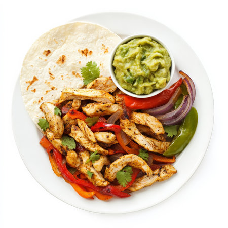 A plate of chicken fajitas with sizzling strips of marinated chicken, bell peppers, and onions, served with warm tortillas, guacamole, and salsa. A Tex-Mex classic thatÃ¢â¬â¢s fun and flavorful. Isolated on clean white backgroundの素材
