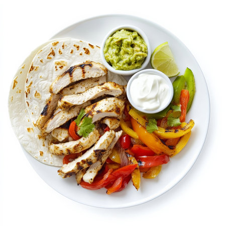 A plate of sizzling fajitas with grilled chicken, bell peppers, and onions, served with warm flour tortillas, guacamole, sour cream, and salsa. This Tex-Mex dish is colorful, flavorful, and customizable to suit any taste. Isolated on clean white backgroundの素材