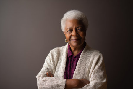 An elderly African-American woman poses proudly for headshots, standing against a clean backdrop that highlights her legacy and mentorship journey.の素材