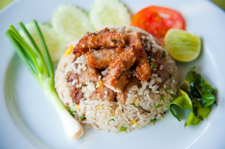 delicious fried rice with deep fried pork and vegetableの写真素材