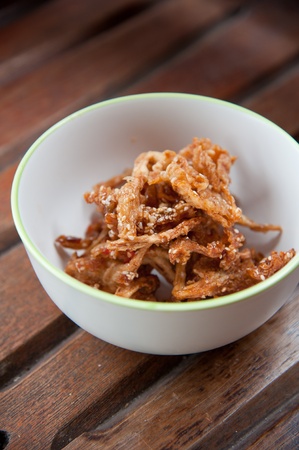 Thailand food : mushroom fry with sesame in white round bowl on wood background patternの写真素材