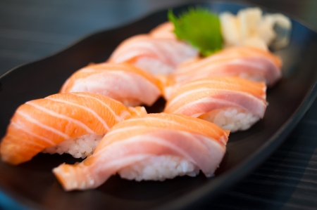 Close up of Salmon Sushi Set on Black Dishの写真素材